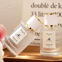 Flacon de parfum cylindrique de luxe personnalisé de 30 ml et 50 ml avec bouchon doré à bille, surface estampée à chaud pour flacon de parfum en verre