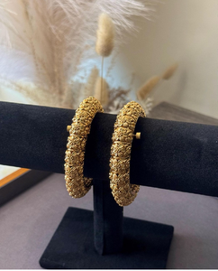 A pair of heavily carved <b>antique</b>-style brass <b>bangles</b>, available at wholesale prices - Product Image 4