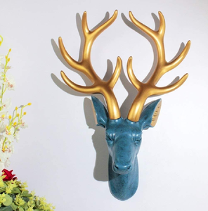 Blue textured deer head with large <b>gold</b> antlers. Unique wall <b>decor</b>, available at wholesale prices. - Product Image 1