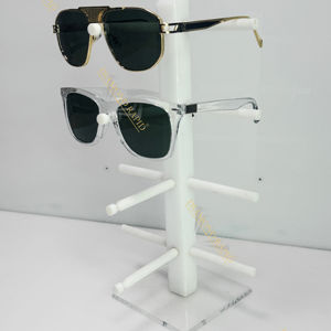 Pour un nouveau présentoir à tige tournante de 6 pieds utilisé dans les magasins d'optique pour présenter des produits de luxe pour lunettes - Product Image 1