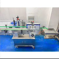 Machine de remplissage et d'étiquetage automatique à grande vitesse pour bouteilles rondes en plastique et en verre