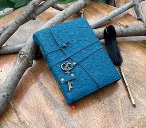 This is a handcrafted embossed leather diary designed in a stunning teal blue color The cover features an elegant floral - Product Image 2