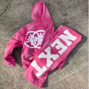 Conjunto de chándal de dos piezas unisex personalizado de talla grande, de tejido grueso y color liso, con sudadera con capucha y pantalones acampanados con dobladillo sin rematar - Product Image 3