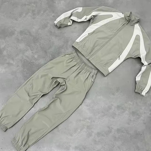 Chándal cortavientos para chaqueta y pantalón con cremallera para hombre 100% nailon pesado logotipo personalizado hombro caído - Product Image 1