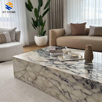 Table basse de luxe en marbre italien, plateau en pierre naturelle de Carrare avec pieds en métal, mobilier tendance 2026 pour salon et villa