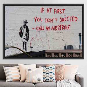 Toile imprimée Banksy 'Call an Airstrike' - Style Street Art, TOILE ENCARTOCHETTE NOIRE - Product Image 1