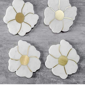 <b>Set</b> of four floral shaped white marble <b>coasters</b> with golden petal outlines. Luxury <b>set</b> available at wholesale prices. - Product Image 1