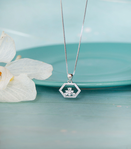 Delicate <b>silver</b> hexagon pendant with a shimmering floral design. A unique piece available at wholesale prices. - Product Image 1