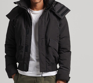 Chaqueta de Invierno Unisex de Estilo Regular, Calidad Premium, Transpirable e Impermeable, de Lona, con Logotipo Frontal, Color Sólido - Product Image 1
