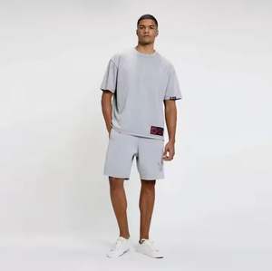 เสื้อยืดคอกลมผ้าคอตตอนสำหรับออกกำลังกายของผู้ชายระบายอากาศได้ดีสีพื้นทรงหลวมไซส์ใหญ่พิเศษและแบบรัดรูป - Product Image 1