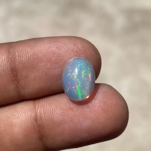 Cabujón de corte ovalado de ópalo etíope sintético tratado térmicamente ópalo arcoíris de fuego múltiple para fabricación de joyas blanco suelto para colgante de anillo - Product Image 4