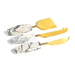 Juego de 3 Cuchillos para Mantequilla de Queso en Tono Dorado, Acero Inoxidable con Elegante Mango Blanco, Ideal para Decoración de Mesa de Boda - Product Image 1