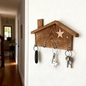 Charming house-shaped wood key holder with a star accent. Available at wholesale prices - Product Image 1