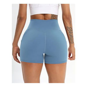 Pantalones cortos de compresión de yoga ligeros para mujer de calidad superior ajustados con bolsillos laterales Top y pantalones cortos de patrón sólido - Product Image 5