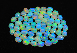 Opale éthiopienne unique en cabochon - Pierre d'opale arc-en-ciel bleu brillant - Forme ovale 6x4mm - Pierre précieuse d'opale à prix de gros - Product Image 6