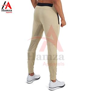 Pantalon pour homme élégant, beige, coupe ajustée, jogging, tissu léger et extensible 250 GSM, poches latérales modernes à fermeture éclair, vêtements de sport décontractés - Product Image 2