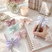 Stylo à bille de luxe avec nœud en strass, cœur en cristal et pavé de diamants, ensemble d'accessoires perlés faits à la main, cadeau pour l'école et le bureau, vente en gros