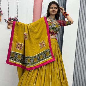 Navratri Special Yellow Color Lehenga Choli en tela de algodón puro con trabajo de estampado de papel de aluminio y trabajo de encaje de cinta para mujeres indias - Product Image 1
