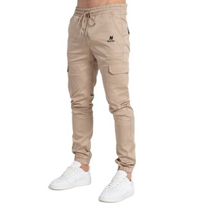 Pantalones largos para hombre con logotipo personalizado al por mayor, pantalones cargo deportivos informales de secado rápido, sólidos, ajustados, suaves y transpirables - Product Image 1