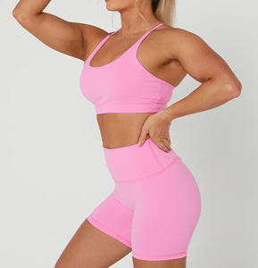 Conjunto de ropa deportiva rosa para mujer con logotipo personalizado, sujetador y pantalones cortos deportivos sin costuras de 2 piezas para entrenamiento de gimnasia, conjunto de yoga al por mayor de LICRA de nailon - Product Image 2