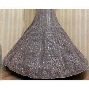 Lehenga de couleur riche avec broderie lourde et tissu en filet Zari Accents pour une silhouette fluide adaptée aux mariages et événements festifs - Product Image 3