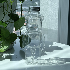 Échantillon gratuit de bouteille de boisson en plastique PET en forme de Bearbrick avec bouchon en aluminium pour le thé au lait et les jus de fruits de plusieurs tailles pour un usage domestique - Product Image 5