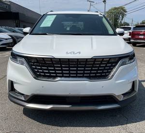 Blanco brillante 2024 Kia Carnival SX FWD usado con ruedas de aleación asientos de cuero sistema de navegación arranque remoto Android Auto - Product Image 1