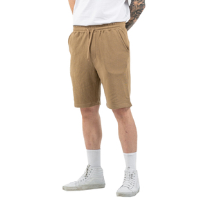 กางเกงขาสั้นลำลองผู้ชาย ผ้าฝ้าย 100% สวมใส่สบาย คุณภาพสูง ระบายอากาศได้ดี แห้งเร็ว เอวกลาง มีเชือกผูก ปิดด้วยเชือกผูก สีพื้น - Product Image 1