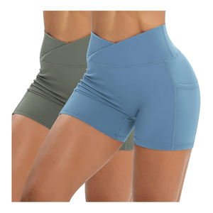 Pantalones cortos de compresión de yoga ligeros para mujer de calidad superior ajustados con bolsillos laterales Top y pantalones cortos de patrón sólido - Product Image 1