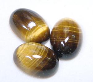 100% Forma ovalada natural Cabujón de ojo de tigre liso Calidad de exportación Piedras preciosas sueltas Disponibles en todos los tamaños y formas OEM - Product Image 1