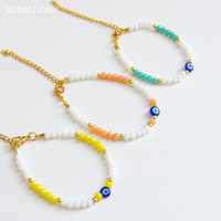 Bracelets en perles de cristal avec breloque œil porte-bonheur, style bohème, cadeau pour femme, symbolisme protecteur et design avant-gardiste