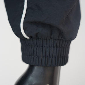 Conjuntos de ropa deportiva ligera de bloque de color de nuevo estilo OEM para hombre de dos piezas de diamantes de imitación chaqueta cortavientos y conjuntos de pantalones de chándal - Product Image 6