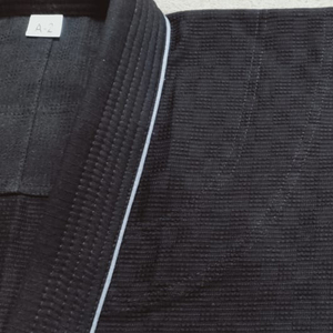 Kimono BJJ GI duradero con tela ligera resistente al desgarro costuras reforzadas que absorben el sudor diseño de secado rápido perfecto - Product Image 3