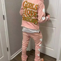 Conjunto de chándal de invierno de moda con estampado serigrafiado, sudadera con capucha corta de dobladillo sin rematar y pantalones de chándal de forro polar acampanados apilados para hombre y maternidad