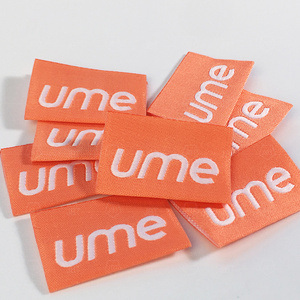 Trung tâm tùy chỉnh gấp quần áo màu cam HEM dệt bên ngoài thẻ logo vải cho may mặc - Product Image 5