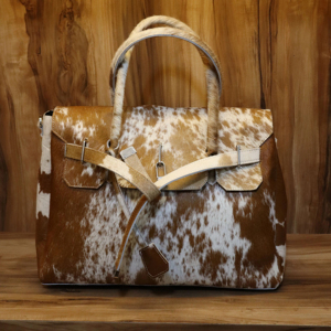 Bolso de mano de piel de vaca occidental para mujer con elegante bolso de hombro con patrón de logotipo de piel de vaca para viajes - Product Image 1