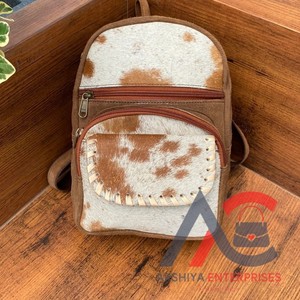 Mini sac à dos en cuir suédé fait main pour femmes, sac à dos de voyage en cuir de vachette à poils occidentaux, sac à dos de randonnée multifonctionnel, vente en gros - Product Image 1