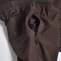 Pantalon de neige haute performance marron, imperméable et coupe-vent, avec isolation polaire et taille élastiquée pour adultes