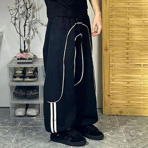 Nouveau pantalon en nylon unisexe coupe ample avec ourlet coupe-vent, coupe régulière, jambe large, nylon - Product Image 4