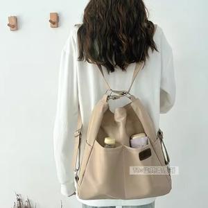 Sac à bandoulière avec poche à rabat avant et sangle réglable, design minimaliste élégant pour un usage quotidien, matériau léger et durable - Product Image 1