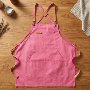 Tablier rose réutilisable avec bretelles croisées et poches pour la cuisine et l'usage quotidien, en coton tissé, style classique, lavable en machine, résistant à l'eau - Product Image 1