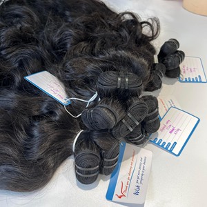 Una gran cantidad de paquetes de cabello ondulado natural vietnamita Proveedor de cabello sin procesar Sin enredos Sin caída de cabello - Product Image 6