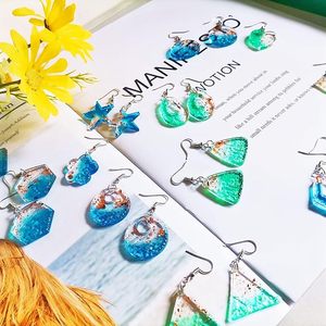 ต่างหูเรซิ่นที่มีดอกไม้จริงและมีกลิตเตอร์ต่างหูเรซินประดับด้วยอีพ็อกซี่สีฟ้ามหาสมุทรจากงานหัตถกรรมโซนส่งออก - Product Image 4