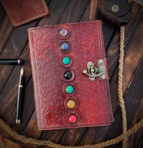 This is a handcrafted leather diary with chakra stones embedded on <b>the</b> cover <b>The</b> diary features seven colorful healing stones - Product Image 1