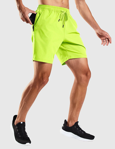 <b>Mens</b> Workout <b>Shorts</b> in Neon Green <b>with</b> Quick Dry Fabric <b>Zip</b> <b>Pockets</b> and 4 Way Stretch for Running Training and Sports - Product Image 1