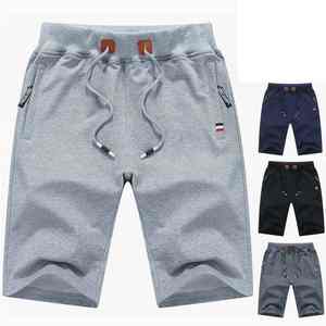 กางเกงขาสั้นกีฬาสำหรับผู้ชายผ้าคอตตอน100% เอวยางยืดปิดลำลองแบบถักลาย - Product Image 1