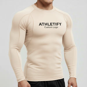 Camiseta de compresión Rashguard Premium para hombre, logotipo personalizado, traje de baño Atlético cómodo de secado rápido, ropa para estilos de vida activos. - Product Image 1