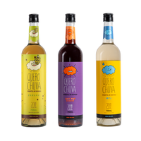 Apéritifs aromatisés Quero Chuva de la marque Degusto : miel, citron vert, noix de coco, cannelle, banane, acaï en bouteilles de 750 ml et 50 ml