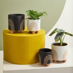 Pot de fleurs en céramique moderne avec pieds surélevés et design minimaliste arc-en-ciel, élégant support décoratif pour plantes d'intérieur - Product Image 2
