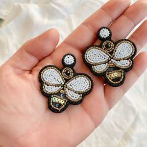 Ivory Buzz Fashion Drop Earrings with Beaded Detail Elegant and Stylish - Product Image 1